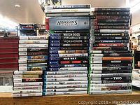 Front view of game cases across multiple consoles