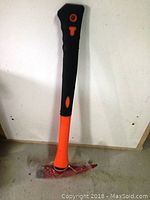 Photo of Black Widow fireman's axe showing full handle and axe head wrapped in plastic.