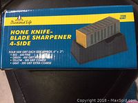 Box showing brand, item name, and details of the four grit sides of the hone sharpener.