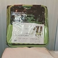 Photo of the 6 piece garden essentials kit packaged in clear plastic wrap showing the contents and product label.