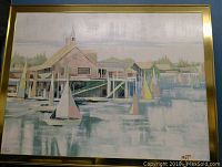 Full view of the large acrylic painting showing the sailboats and seaside village scene in gold finished frame.