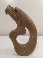 Photo from front angle showing the eagle's head and curved body with open center space.