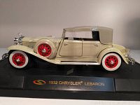 Side view of 1932 Chrysler LeBaron model car on black display base