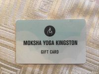 Plastic gift card from Moksha Yoga Kingston with logo and text 'MOKSHA YOGA KINGSTON GIFT CARD'.