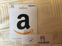 Front full view of Amazon $50 gift card package with large Amazon logo and card value.