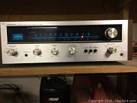 Pioneer SX-424 stereo receiver front panel with tuning dial, knobs for speaker, bass, treble, volume, selector, and headphone jack port