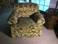 Photo of large upholstered armchair with floral pattern fabric