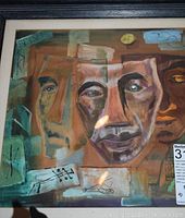 Framed abstract painting with multiple faces in earthy brown, teal, and beige tones showing layered faces and artistic geometric elements.