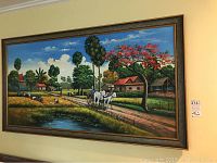 Frontal view of the large framed oil painting showing the entire rural scene with ox cart and workers in the field.