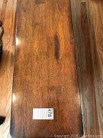 Top-down view of one bench showing wood grain pattern and finish