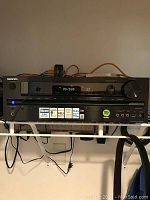 Full front view of Onkyo TX-NR535 AV receiver showing the display, input selection buttons, volume knob, and connection ports.