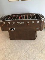 Front and side view of table showing cabinet finish, leg base and scoring dials