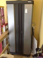 Front view of Kobalt utility cabinet with closed double doors in black and gray finish.