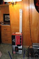 Photo showing boxed Gibraltar Elite metal mailbox with visible branding and packaging details.