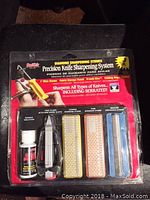 Front view of Smith's Precision Knife Sharpening System packaging showing all included items in sealed blister pack.
