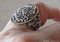 Side view showing open work design and fit on finger