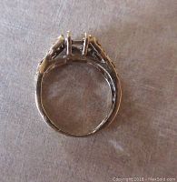 Top-down view of vintage 14K yellow gold ring setting showing empty stone prongs and detailed design