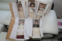 Five Victorian porcelain dolls in original boxes with packaging, COAs shown, names Elizabeth, Kayla, April, Caroline, Maid Marion.