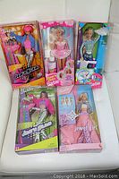 Photo showing all five boxed Barbie dolls: Jam n Glam Teresa, two Jam n Glam Barbies, Jewel Girl Barbie, and Tie Dye Barbie.