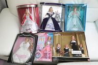 Display of six boxed Barbie dolls including Holiday Celebration, Millennium Diamond, Evening Recital set with children dolls, Jewel Girl, Millennium Princess, and Collectors Barbie.