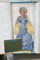 Porcelain doll Kimberly in original box with certificate and decorative tissue paper, sealed in plastic wrapping