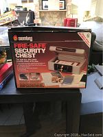 Photo of Sentry Fire-Safe Security Chest Model 1150 box showing chest is fire resistant and lockable with keys included
