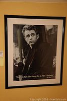 Framed black and white print of James Dean with quote