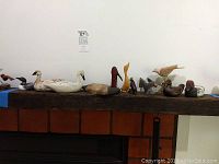Group shot of all figurines displayed on wooden mantel