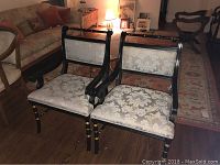 Front view of two chairs in a living room setting