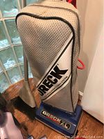 Oreck XL upright vacuum cleaner with cloth bag and nozzle attachment, showing condition and branding.