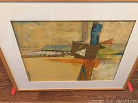 Framed and matted abstract wall art collage titled COLLAGE #6 by Ann McDowell, visible geometric shapes with tones in beige, brown, orange, blue, and green.