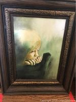 Front view of framed painting showing subject, frame style, and overall condition