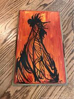 Full view of “Red Rooster” painting showing black rooster silhouette on orange-red background