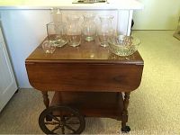 Front view of tea cart with glassware on top