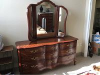 Full view of classic bow front triple dresser with butterfly triple mirror showing overall condition and style.