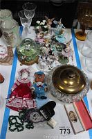 Wide view of the lot including fairy figurines, bear dolls, glass dishware, and miniature piano items