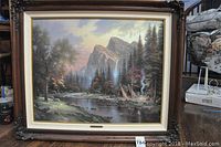 Front view of framed Thomas Kinkade lithograph showing full artwork and frame