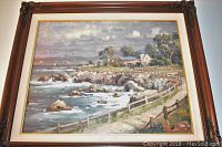 Full view of framed lithograph “Seaside Village”