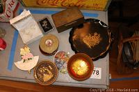 Overview photo showing all items arranged on a surface, including trinket boxes, the black lacquered dish, and angel figurines.