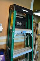 Close-up of the black plastic top with Husky branding and warnings.