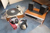 Overall shot of turntable, receiver, speakers and headphones