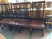 Four chairs in a row showing front and side views