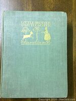 Front cover of the book showing green cloth binding with gold embossed text and illustration.