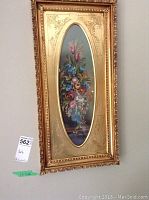 Front view of framed oval oil painting showing full floral bouquet composition.