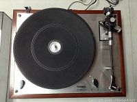 Top-down view showing platter with rubber mat, speed selector, Thorens logo and S-shaped tonearm