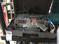 Bosch FS2000 Fine Cut trim saw shown inside its gray plastic carrying case with compartments for accessories and parts.