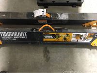 Top view of ToughBuilt C550 Sawhorse in folded state showing brand and model label.