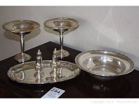 Overall view of two sterling silver compotes, salt and pepper shakers on tray, and fruit bowl