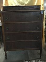 Front view of antique high boy dresser showing all six drawers and original hardware.