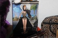 Barbie Day In The Sun Hollywood Movie Star doll in original display box, wearing leopard print swimsuit and black cape.